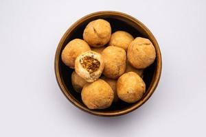 Dry kachori is a dry fruits stuffed ball shaped farsan also called kachauri, kachodi and katchuri photo