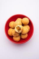 Dry kachori is a dry fruits stuffed ball shaped farsan also called kachauri, kachodi and katchuri photo