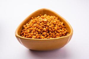 Fried and Spicy Chana Dal Masala namkeen is a popular Chakna recipe. served in a bowl photo