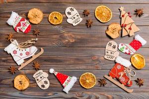 Top view of Christmas decorations and toys on wooden background. Copy space. Empty place for your design. New Year concept photo