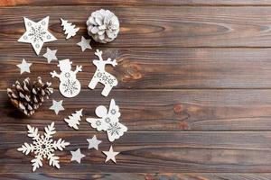 Top view of Christmas decorations and toys on wooden background. Copy space. Empty place for your design. New Year concept photo