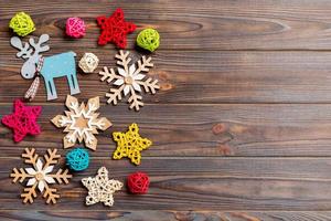 Top view of Christmas decorations and toys on wooden background. Copy space. Empty place for your design. New Year concept photo