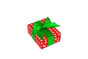 Christmas or other holiday handmade present in red paper with Green ribbon. Isolated on white background, top view. thanksgiving Gift box concept photo