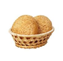 A fresh basket of golden brown hard crusted buns. Shot on white background photo