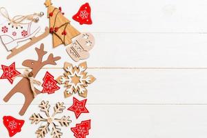Top view of Christmas decorations and toys on wooden background. Copy space. Empty place for your design. New Year concept photo