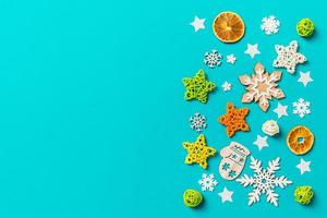 Top view of blue background with New Year toys and decorations. Christmas time concept with copy space photo