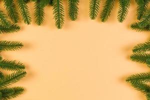 Top view of colorful festive background made of fir tree branch. Christmas holiday concept with copy space photo