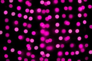 Unfocused abstract colourful bokeh purple background. defocused and blurred many round purple light photo