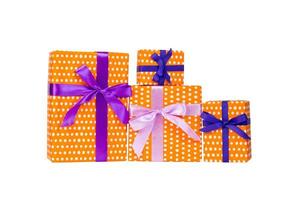 Set of Christmas or other holiday handmade present in orange paper with purple ribbon. Isolated on white background, top view. thanksgiving Gift box concept photo