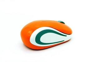 Close up used orange and white wireless or Bluetooth computer mouse isolated on white background with clipping path or make selection. Technology, Electronic device and gadget. photo