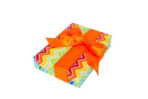 Christmas or other holiday handmade present in colored paper with orange ribbon. Isolated on white background, top view. thanksgiving Gift box concept photo