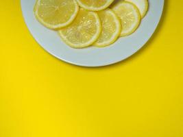 Sliced citrus fruit. Lemon on the table. sour photo