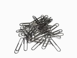 Large paper clips on a white background. Office supplies isolate. Paper fastening. Paper clips. photo