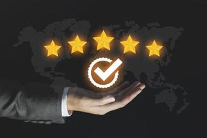 Businessman give rating to service experience, User Experience concept, Customer review satisfaction feedback survey, Customer giving a Five Star to business ranking photo