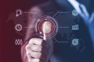 Businessman Fingerprint scan provides security access with biometrics identification, Concept of Future Business Safety technology and cybernetics. photo