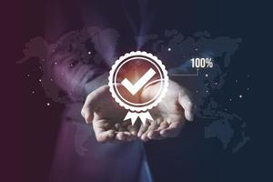 Businessman showing virtual guarantee symbol background, Standard quality control certification assurance guarantee concept. Hands giving the best quality of product and service to customer photo