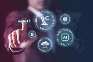 Businessman showing virtual industry 4.0 concept, IoT, automation monitoring system. Robotics and digital manufacturing operation industrial technology, Global futuristic automatic technology concept. photo