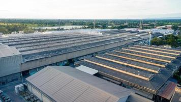 Aerial view from drone take above of industrial buildings, warehouses or factory storages, or logistic company photo