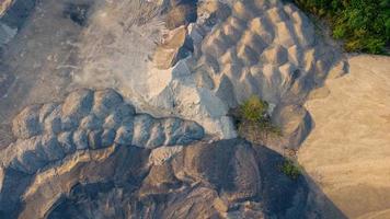 Lots of sandstone hills on the grounds of the cement factory before being transported as raw materials. photo