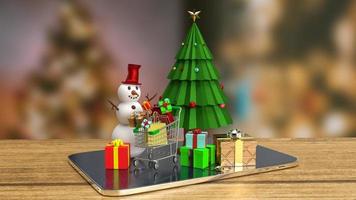 el árbol de navidad y el muñeco de nieve en la tableta para el concepto publicitario de representación 3d foto
