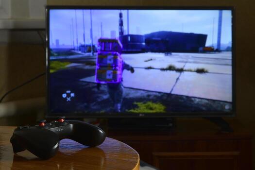 KHARKOV, UKRAINE - MAY 12, 2022 Video game controller Gamesir g3s on table with Death Stranding game on display photo