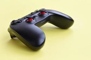 KHARKOV, UKRAINE - MAY 12, 2022 Gamesir g3s video game controller on yellow background photo