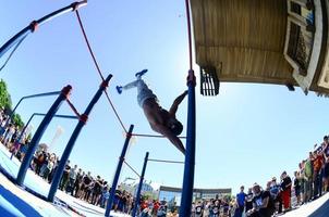 KHARKIV, UKRAINE - 27 MAY, 2022 Street workout show during the annual festival of street cultures photo