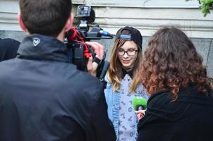 KHARKOV. UKRAINE - MAY 17, 2022 Participants of the first LGBT action in Kharkov give interviews about an unexpected attack and disruption of the event photo