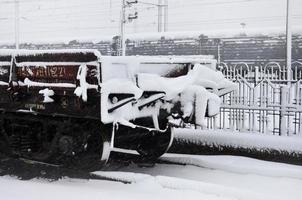 KHARKIV. UKRAINE - APRIL 4, 2022 Unexpected rapid fallout of snow in April on the Kharkov streets photo