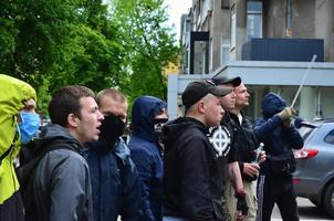 KHARKOV, UKRAINE - MAY 17, 2022 The organization of Ukrainian Nazis and patriots of the Eastern Corps stops the LGBT action in Kharkov. Hooligans and ultras against the existence of minorities photo