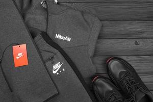 KHARKOV, UKRAINE - DECEMBER 20, 2022 Nike brand clothes and shoes sport wear kit. Nike is American multinational corporation engaged in manufacturing and worldwide marketing of clothes and footwear photo