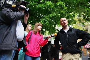 KHARKOV. UKRAINE - MAY 17, 2022 Participants of the right-wing Nazi and patriotic movement give interviews on the forced cessation of the first LGBT action in Kharkov photo