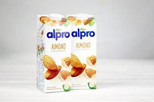 KHARKOV. UKRAINE - MAY 2, 2022 Alpro almond and hazelnut milk packs produced by European company from Wevelgem, Belgium photo