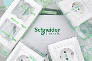 KHARKOV. UKRAINE - MAY 2, 2022 Schneider electrics box of plastic electrical outlets with european plug standard. Schneider Electric is a European multinational company providing energy photo