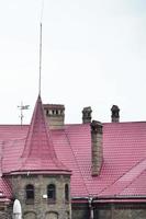 Fragment of a metal roof of the restored old multi-storey building in Lviv, Ukraine photo