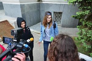 KHARKOV. UKRAINE - MAY 17, 2022 Participants of the first LGBT action in Kharkov give interviews about an unexpected attack and disruption of the event photo