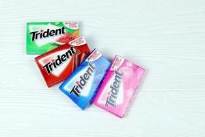 KHARKIV, UKRAINE - MARCH 15, 2022 Packs of Trident gums. Trident was introduced in 1964 as one of the first patented sugarless gums photo