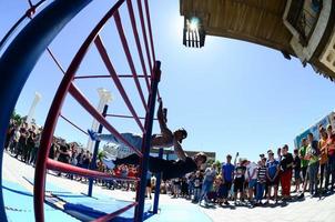 KHARKIV, UKRAINE - 27 MAY, 2022 Street workout show during the annual festival of street cultures photo