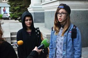 KHARKOV. UKRAINE - MAY 17, 2022 Participants of the first LGBT action in Kharkov give interviews about an unexpected attack and disruption of the event photo