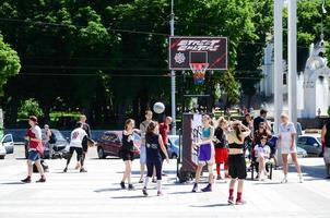 KHARKIV, UKRAINE - 27 MAY, 2022 Women's teams play streetball in the open air during the annual festival of street cultures photo