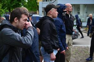 KHARKOV, UKRAINE - MAY 17, 2022 The organization of Ukrainian Nazis and patriots of the Eastern Corps stops the LGBT action in Kharkov. Hooligans and ultras against the existence of minorities photo