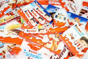 KHARKIV, UKRAINE - FEBRUARY 14, 2022 Kinder Chocolate various production. Kinder is a confectionery product brand line of multinational confectionery Ferrero. photo