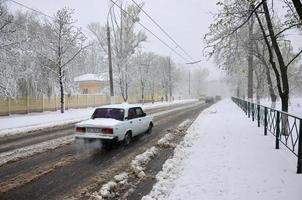 KHARKIV. UKRAINE - APRIL 4, 2022 Unexpected rapid fallout of snow in April on the Kharkov streets photo