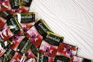 KHARKOV. UKRAINE - MAY 17, 2022 Greenfield Spring Melody tea bags. Greenfield manufactured by Orimi Trade and Greenfield Tea ltd. photo