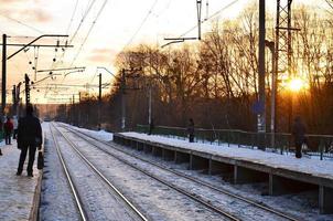 Evening winter landscape with the railway station photo