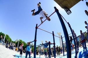 KHARKIV, UKRAINE - 27 MAY, 2022 Street workout show during the annual festival of street cultures photo