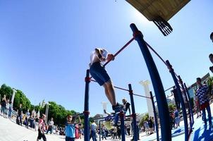 KHARKIV, UKRAINE - 27 MAY, 2022 Street workout show during the annual festival of street cultures photo