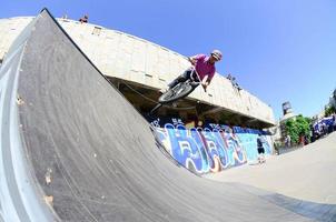 KHARKOV. UKRAINE - MAY 2, 2022 Freestyle BMX riders in a skatepark during the annual festival of street cultures photo