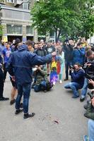 KHARKOV, UKRAINE - MAY 17, 2022 The organization of Ukrainian nazis and patriots of the Eastern Corps burns the flag of LGBT in Kharkov. Hooligans and ultras against the existence of minorities photo