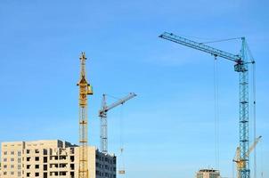 Building under construction with crane photo